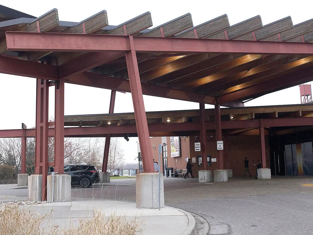 Casino Ajax: the timber-and-steel entrance canopy over the drop-off loop